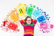  girl surrounded by school supplies